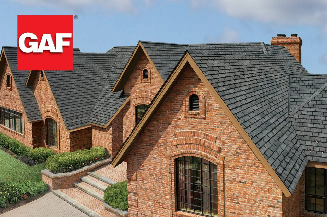 Brick home with dark gray GAF architectural shingles and multiple gables