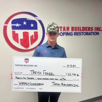 Tartan Builders charity donation check