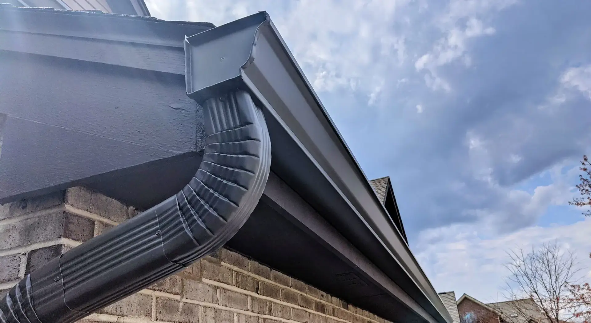 Black seamless gutter installation